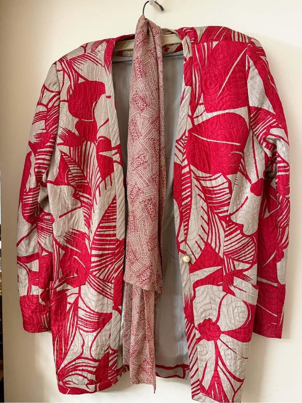 Red Floral Quilted Jacket with Neutral Background